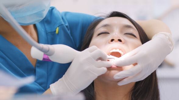 Dental patient receiving gum disease treatment in Mississauga