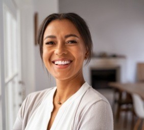 Woman in white blouse grinning