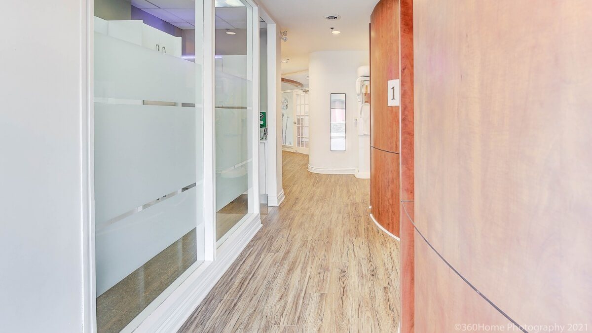 Hallway with light wood flooring