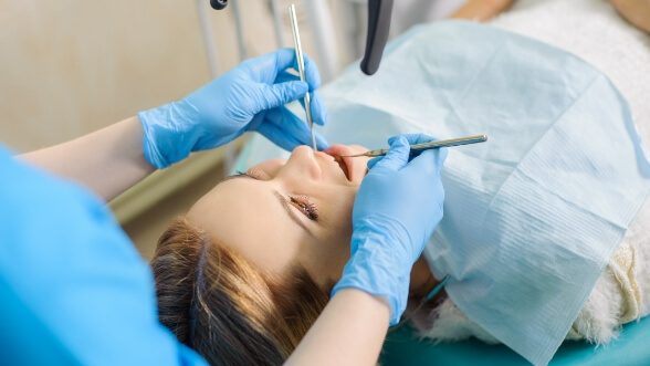 Woman being treated by her dentist